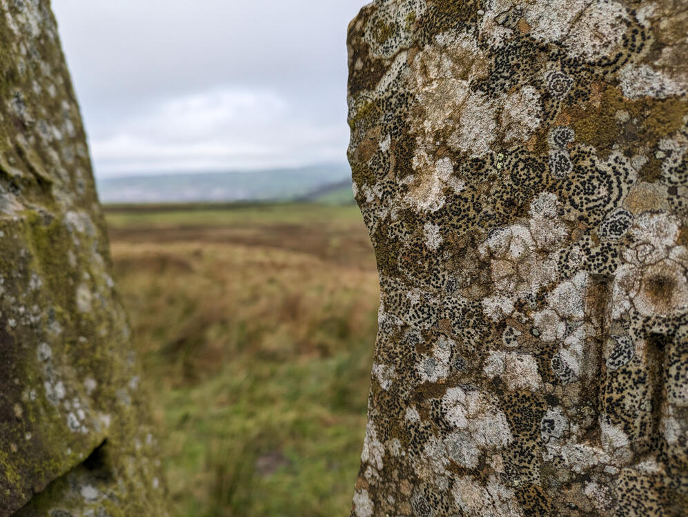 Moorland horizon through two pieces of stone,above Bingley